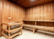Thumbnail 61 of 75 - an empty sauna with wooden walls and benches
